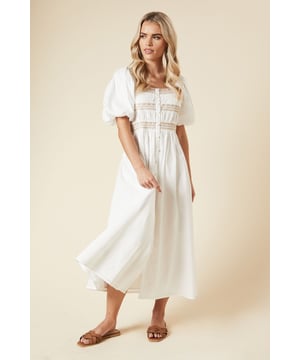 Charming square neckline with delicate embroidery detail
        Elegant button-through front for easy wear
        Voluminous puff sleeves add a romantic touch
        Fitted waist with intricate embroidered bands
        Flowing midi length skirt for a graceful silhouette
    
    Embrace effortless elegance with this enchanting poplin midi dress from Dorothy Perkins. Perfect for the fashion-forward woman in her 30s who appreciates a blend of trend and modesty. The square neckline and embroidered bust create a flattering focal point, while the button-through design offers both style and practicality. The puff sleeves add a whimsical element, balancing beautifully with the fitted waist and flowing skirt. Ideal for casual events and family gatherings, this dress can be styled with flat sandals for a relaxed brunch with friends or dressed up with wedges for a baby shower. The versatile design allows for easy transition from day to evening, making it a wardrobe staple for various occasions. Pair with a denim jacket and a woven bag for a chic, laid-back look that's sure to turn heads.