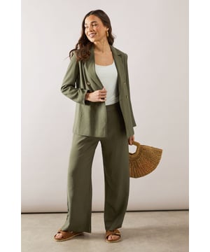 Elegant straight leg design for a timeless silhouette
        Pleated front detail adds sophistication and structure
        Wide waistband for a comfortable and flattering fit
        Side pockets for practicality and style
        Versatile length suitable for various shoe choices
    
    These straight leg pleated trousers from Wallis are the epitome of effortless chic. Perfect for the woman who values both comfort and style, they offer a sophisticated look for various daytime occasions. The pleated front adds a touch of refinement, while the straight leg cut ensures a flattering fit for all body types. Style these trousers with a crisp white blouse and ballet flats for a polished look at family gatherings, or pair with a soft knit jumper and loafers for a smart-casual ensemble ideal for lunch with friends. The versatile design makes these trousers a wardrobe staple, easily transitioning from a day at the office to weekend brunches. Accessorise with a statement necklace and a structured tote to complete your look with Wallis' signature glamour.