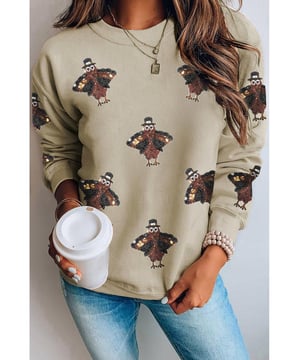 Sudadera de Día de Acción de Gracias con Patrón de Pavo Brillante  
Opción cómoda para el invierno  
Perfecta para celebraciones de Acción de Gracias o noches acogedoras en casa  
Diseño de cuello redondo  
Corte holgado adecuado para el uso diario  
Combina bien con jeans o pantalones casuales  
Ideal para mantener un estilo elegante durante los meses de otoño  
Material: 50% Poliéster 50% Algodón