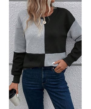 Klassisches Oberteil mit abfallenden Schultern und Colorblock-Design  
Texturierten Stoff fügt eine einzigartige Note hinzu  
Hochwertig und vielseitig  
Lässt sich gut mit Jeans und Jogginghosen kombinieren  
Größentabelle verfügbar für eine perfekte Passform  
Ein Muss für jede Garderobe  
Material: 97% Polyester, 3% Elasthan