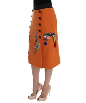Precioso a estrenar con etiquetas.
  Hecho en Italia.
  Material 100% lana virgen.
  Color naranja con adornos multicolores.
  Torre Strass Pisa y aplique de la estatua de Appolo.
  Flores de cristal seda y cosidas.
  Forro elastico de seda.
  Cierre de crema.