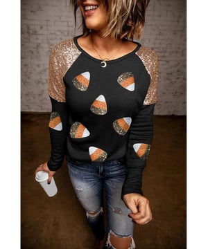 Schwarzes Oberteil mit Pailletten-Schulterakzenten  
  Muster mit Candy-Corn-Patches  
  Raglanärmel  
  Ideal für die Halloween-Saison  
  Passt gut zu dunklen Jeans oder Leggings  
Material: 95% Polyester, 5% Spandex