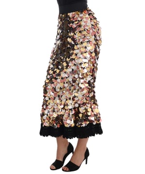 Marca: Dolce & Gabbana.
  Estilo: Cintura alta peplum lapiz recto.
  Color: Negro con lentejuelas plateadas bronce y doradas.
  Cierre: Cremallera.
  Cintura: Elastica.
  Forro: Algodon negro elastico.
  Detalles: Logotipo.
  Origen: Made in Italy.
  Artesan.