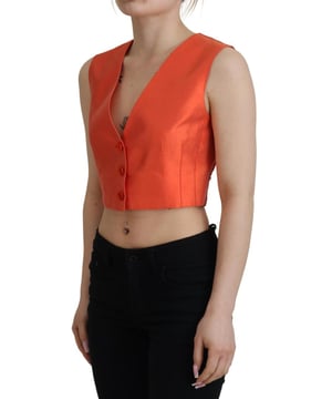 Marke: Dolce & Gabbana  
Zustand: Neu mit Etikett  
Stil: Weste  
Farbe: Orange  
Verschluss: Logo-Knopf  
Hergestellt in Italien  
Material: 96% Seide, 4% Elasthan  
Geschlecht: Damen