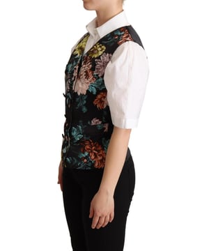 Marke: Dolce & Gabbana  
Typ: Weste  
Stil: Blumendruck  
Verschluss: Knopf  
Material: 60% Polyester, 37% Seide, 3% Elasthan  
Farbe: Schwarz mit mehrfarbigem Floral-Jacquard  
Ärmelloses Design  
Logo-Details  
Hergestellt in Italien