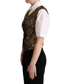 Marke: Dolce & Gabbana  
Zustand: Neu mit Etikett  
Stil: Ärmellose Weste  
Material: 37% Seide, 30% Polyester, 20% Baumwolle, 10% Faser, 3% Elasthan  
Farbe: Schwarz-Gold  
Verschluss: Vorderer Knopf  
Herkunft: Hergestellt in Italien  
Details: Logodetails  