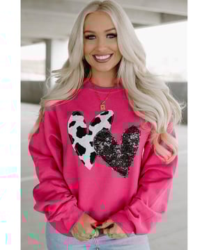 Trendy and eye
  catching design
  Cow & sequin double heart patch on the front
  Soft and cozy feel
  Perfect for lounging or running errands
  Versatile design can be easily mixed and matched
  Available in various chic styles and sizes
  Size chart in CM and INCH provided
Material: 62.7% Polyester 37.3% Cotton