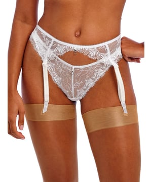 Freya Fascinate Suspender Belt. High rise suspender belt with decorative eyelash edge lace, adjustable suspender straps, hook and eye fastening and metallic ring detailing. Product is hand wash only.
