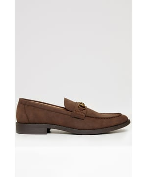Refined elegance meets everyday comfort with these sleek snaffle loafers from Threadbare. These faux leather shoes feature a sleek slip-on design with a polished metal snaffle over the saddle. A cushioned insole offers all-day comfort, while the slight heel and durable sole add a sharp finish. Perfect for both smart and casual styling, these loafers are a versatile must-have for any modern wardrobe.