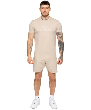 The Enzo Men's Gym Tracksuit is designed for both performance and style. The slim-fit T-shirt contours to the body for a sleek, athletic look, while the ribbed crew neck adds durability. The stretch material with Lycra fabric ensures maximum flexibility and comfort. The matching gym shorts feature a regular fit for ease of movement, with an elasticated waistband for a secure fit. The bold Enzo Jeans branding on both pieces adds a sporty edge.