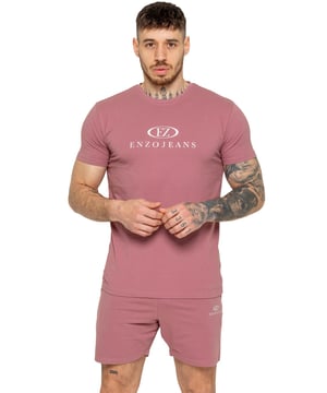 The Enzo Men's Gym Tracksuit is designed for both performance and style. The slim-fit T-shirt contours to the body for a sleek, athletic look, while the ribbed crew neck adds durability. The stretch material with Lycra fabric ensures maximum flexibility and comfort. The matching gym shorts feature a regular fit for ease of movement, with an elasticated waistband for a secure fit. The bold Enzo Jeans branding on both pieces adds a sporty edge.