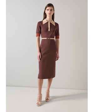 Imagine being in the epitome of sophistication with our Rosey chain belt trim Milano knit dress. This black colourblock dress, made from a luxurious viscose mix, features a gold effect metal snaffle, buttons, and a stretch knit design for effortless elegance. Perfectly pair it with classic pumps for work or stylish ankle boots for a night out.