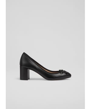 Experience timeless elegance with our Juliette high heel grosgrain ballerina courts. In sleek black nappa leather with a round toe and block heel, they offer a blend of smart casual sophistication and sustainable luxury. Perfect with tailored trousers for the office or a stylish dress for an evening out. Made in Spain.