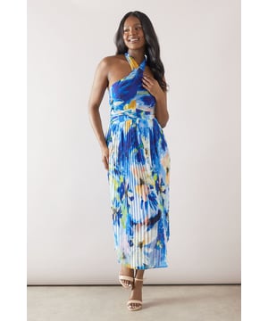 Striking halterneck design for a sophisticated neckline
        Pleated midi skirt adds graceful movement and texture
        Eye-catching floral pattern creates a vibrant, artistic look
        Fitted waistband accentuates the silhouette
        Sleeveless style perfect for warm-weather occasions
    
    Embrace elegance and femininity with this stunning floral halterneck pleated midi dress. The graceful pleats cascade down the skirt, creating a fluid and flattering silhouette that's ideal for both daytime events and evening soires. The halterneck design adds a touch of sophistication, while the vibrant floral pattern ensures you'll stand out at any gathering. Style this versatile piece with strappy metallic sandals and delicate jewellery for a polished look at weddings or garden parties. For a more relaxed ensemble, pair it with wedge espadrilles and a woven clutch for alfresco dining or summer brunches. The midi length offers a perfect balance of modesty and allure, making it a go-to choice for various formal occasions, from race days to graduation ceremonies. This dress embodies the essence of Wallis, offering both comfort and glamour for the woman who appreciates timeless style with a contemporary twist.