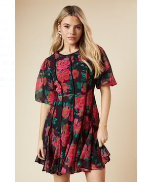 Chiffon fabric with striking floral print
        Contrast binding detail on bodice
        Flattering mini length
        Elegant crew neckline
        Flutter sleeves for a feminine touch
    
    This enchanting mini dress from Dorothy Perkins Luxe collection is a perfect choice for the fashion-forward woman in her 30s. The chiffon fabric adorned with a bold floral print creates a captivating look, while the contrast binding on the bodice adds a sophisticated touch. The mini length is ideal for showcasing your legs without revealing too much, making it suitable for various occasions. Style this versatile piece with strappy heels and statement earrings for a wedding or a formal event. For a more relaxed look, pair it with ankle boots and a cropped jacket for a chic brunch ensemble. The flutter sleeves and crew neckline offer a balanced silhouette, ensuring you'll feel confident and stylish whether you're attending a baby shower or meeting friends for afternoon tea. This dress effortlessly combines trend-conscious design with timeless elegance, making it a wardrobe staple for the modern British woman.