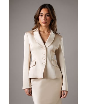 Elegant waisted jacket with luxurious satin lapel
        Flattering fitted silhouette with nipped-in waist
        Sophisticated button-front closure
        Sleek long sleeves with button detailing at cuffs
        Versatile crepe fabric for a polished look
    
    Exude sophistication and grace with this stunning waisted jacket from Coast. The satin lapel adds a touch of luxury, while the fitted silhouette accentuates your figure beautifully. Perfect for formal occasions, this jacket pairs seamlessly with the matching skirt for a coordinated ensemble that's sure to turn heads. Style it with elegant heels and a clutch for weddings or race days, or dress it down with tailored trousers for a chic office look. The versatile crepe fabric ensures comfort and ease of movement, making it an ideal choice for long events. Whether worn as part of a suit or as a standalone piece, this jacket is a wardrobe essential that embodies Coast's commitment to timeless elegance and quality craftsmanship.