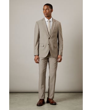 Tailored fit for a refined silhouette
        Notched lapels for classic sophistication
        Two-button front closure for versatile styling
        Flap pockets add functional elegance
        Four-button cuffs for a polished finish
    
    This Burton tailored fit suit jacket offers a perfect balance of classic style and modern cut. The jacket is designed to define your shoulders and chest while tapering at the waist for a flattering silhouette. Ideal for the gentleman who appreciates timeless elegance, this jacket is versatile enough for various occasions. Pair it with matching trousers and a crisp white shirt for formal events, or dress it down with chinos and loafers for smart-casual gatherings. The neutral hue allows for easy coordination with a range of shirt and tie combinations, making it a staple for your professional wardrobe. Whether you're heading to an important business meeting or joining mates for a sophisticated night out, this jacket will ensure you look sharp and feel confident.