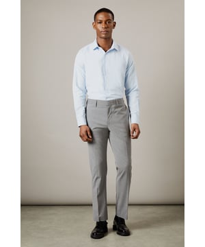 Tailored fit for a refined silhouette
        Textured fabric adds depth and interest
        Belt loops for versatile styling options
        Side pockets for practicality
        Crisp centre crease for a polished look
    
    These Burton suit trousers present a sophisticated option for the discerning gentleman. The tailored fit sculpts the silhouette while offering ease of movement, perfect for the man who values both style and comfort. The textured fabric introduces a subtle element of visual interest, setting these trousers apart from plain alternatives. Pair with the matching jacket for a complete suit, or style separately for smart-casual occasions. For a classic office look, team with a crisp white shirt and polished Oxfords. Alternatively, dress down with a fine-knit jumper and smart trainers for after-work drinks. The versatility of these trousers makes them a valuable addition to any wardrobe, suitable for everything from important business meetings to sophisticated evening events.