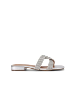 The Rebel is a slip-on sandal. There is a crystal embellishment across the entire curved strap.