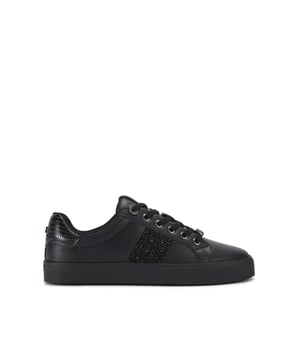 This KG Kurt Geiger Lucie sneaker is crafted in black with statement crystal embellished panels across each side. The front laces up with gunmetal eyelets. There is lizard embossing on the heel.