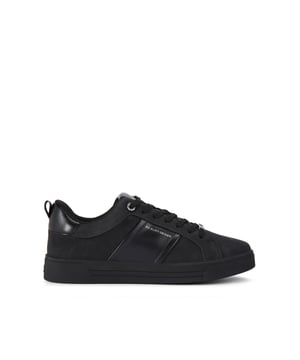 The Carvela Noah is a black sneaker with grained texture. The front laces up with black hardware across the shoe.