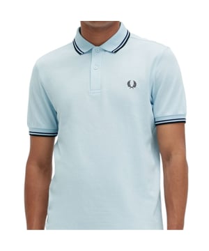 The Twin Tipped Fred Perry Polo Shirt by Fred Perry is a short sleeved polo shirt that has been made from Fred Perry's classic cotton piqué, in a contemporary adaptation of Fred's famous streamlined fit. Available in a diverse range of colourways - each with their own unique story. Featuring the signature Fred Perry wreath logo to the chest and twin tipping to the collar and cuffs.