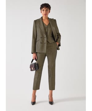 The Bella Jacket features bold black and gold metallic stripes, crafted from a luxurious blend and finished with faux horn buttons. Ideal for evening wear, it pairs well with sleek trousers or a black dress.