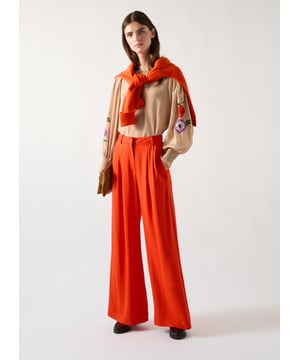 Sykes trousers offer a stylish option of bold orange, crafted from a viscose blend. These trousers feature a front fly, belt loops, and stretchable fabric for comfort. Pair with a crisp blouse or tailored blazer for a chic, professional look. Ideal for making a statement at the office or during important meetings.