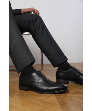 Enhance your formal footwear collection with these  Adam textured oxford lace up work dress shoes. Designed with sophistication and comfort in mind, these shoes are the perfect choice for formal occasions, business meetings, or evening events. 
Key Features: 
 Chic Design: The lace up offers a distinctive and stylish look, setting these shoes apart from conventional formal footwear. The smooth leather finish and clean lines create a polished and sophisticated appearance. 
  Durable Construction: Made with high-quality PU material, these shoes are built to last. The sturdy outsole ensures reliable wear, while the precise stitching adds durability and refinement to the overall design. 
   Comfortable Fit: Designed for all-day wear, these shoes feature a padded insole that provides excellent cushioning. The slip-resistant outsole ensures stability and comfort, making them ideal for long hours of wear. 
Specifications 
Material: Premium-quality faux leather 
Closure: Lace up. 
Outsole: Durable and slip-resistant 
Elevate your formal attire with these Michael textured oxford lace up work dress shoes. Combining style, durability, and comfort, they are an essential addition to any wardrobe. Perfect for professionals and fashion-forward individuals alike!