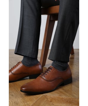 Enhance your formal footwear collection with these  Michael oxford lace up work dress shoes . Designed with sophistication and comfort in mind, these shoes are the perfect choice for formal occasions, business meetings, or evening events. 
Key Features: 
 Chic Design: The lace up offers a distinctive and stylish look, setting these shoes apart from conventional formal footwear. The smooth leather finish and clean lines create a polished and sophisticated appearance. 
   Durable Construction: Made with high-quality PU material, these shoes are built to last. The sturdy outsole ensures reliable wear, while the precise stitching adds durability and refinement to the overall design. 
   Comfortable Fit: Designed for all-day wear, these shoes feature a padded insole that provides excellent cushioning. The slip-resistant outsole ensures stability and comfort, making them ideal for long hours of wear. 
Specifications 
Material: Premium-quality faux leather 
Closure: Lace up. 
Outsole: Durable and slip-resistant 
Elevate your formal attire with these Nick oxford lace up work dress shoes. Combining style, durability, and comfort, they are an essential addition to any wardrobe. Perfect for professionals and fashion-forward individuals alike!