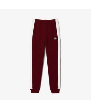 Dames Lacoste Sporty & Rich Stretch Joggers.- Natuurlijk tot comfort bij taille en heupen met rechte pijp.- Gecontrasteerd juk langs zijkant.- Elastische taille verstelbaar met rijgkoord.- Elastische onderkant broekspijp.- Steekzakken aan voorkant. Materiaal: 86% Katoen, 14% Polyamide. Ref: XF849786A.