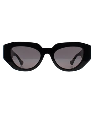 Gucci Cat Eye Womens Shiny Black Grey GG1421S  Sunglasses embody a bold and striking design with oversized, geometric frames that make a statement. The luxurious gold accents on the temples add a touch of elegance, while the high-quality lenses ensure excellent UV protection. These sunglasses are perfect for fashion-forward individuals who want to elevate their look with a touch of classic Gucci flair, combining both sophistication and a contemporary edge.