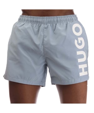 Mens HUGO Abas Logo Print Swim Shorts in blue.- Elasticated drawstring waistband.- Side pockets.- Back pocket.- Printed HUGO logo.- 100% Polyester (Recycled).- Ref: 50513979483