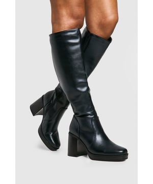 Knee-high boots with a sleek, streamlined silhouette
        Chunky block heel for added height and stability
        Mid-height heel between 5 and 6.5cm for comfortable all-day wear
        Platform sole for extra elevation and comfort
        Smooth, synthetic leather upper for a polished look
    
    Step out in style with these versatile knee-high boots, perfect for elevating your casual ensembles or complementing your night-out attire. The chunky block heel and platform sole offer a fashionable boost while ensuring comfort for extended wear. Pair these statement boots with a flowing midi dress and oversized jumper for a chic daytime look, or team them with a mini skirt and cropped jacket for an edgy evening ensemble. The sleek design makes them ideal for various occasions, from family gatherings to casual outings with friends. Their adaptable nature allows for seamless transition from day to night, making them a must-have addition to your footwear collection. Embrace the bold silhouette and make a lasting impression wherever you go with these eye-catching knee-high boots.