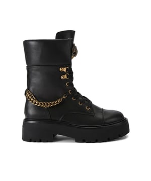 This Kurt Geiger Kensington Combat Boot is crafted from a black leather. There is a statement lace up front with antiqued brass eyelets and a matching chain around the back of the ankle. There is an antiqued brass eagle head on the tongue.