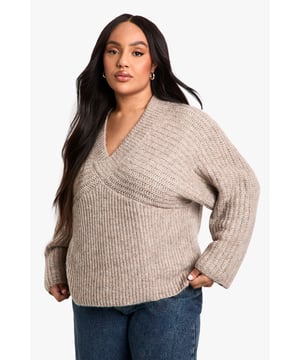 Ribbed texture for added visual interest
        V-neckline for a flattering silhouette
        Wide sleeves for a relaxed, comfortable fit
        Cropped length perfect for layering
        Versatile design suitable for various casual occasions
    
    Embrace comfort and style with this plus-size ribbed V-neck jumper. The wide sleeves offer a trendy, relaxed look while the cropped length adds a contemporary touch to your wardrobe. Perfect for those laid-back days, this jumper can be easily styled for various casual events. Pair it with high-waisted jeans and trainers for a quick coffee run, or dress it up with wide-leg trousers and statement earrings for a family gathering. The ribbed texture adds depth to your outfit, making it an ideal choice for transitional weather. Whether you're lounging at home or meeting friends for a casual lunch, this jumper provides the perfect blend of cosiness and chic appeal. Its versatility allows for effortless styling, making it a must-have addition to your everyday wardrobe.