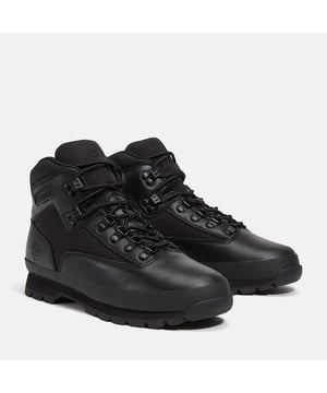 Hiking boots crafted with premium Timberland® leather and canvas upper, cushioned EVA footbed, and ReBOTL™ fabric lining made from at least 50% recycled PET plastic. Durable rubber lug outsole for enhanced traction.