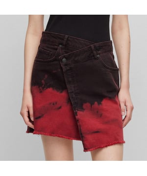 Trendy mini skirt - criss-cross waist band - assymmetric shape - degradé optic - sustainable black denim - red HUGO leather jacron badge - main material: 98% cotton  2% elastane - pocket lining: 57% polyester  40% cotton  3% elastane - machine washable.