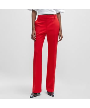 Hugo Hovani regular fit broek voor dames.- Haak- en ritssluiting.- HUGO-merk.- Regular fit.- Bootcut pijp. Materiaal: 64% polyester, 31% viscose, 5% elastaan. Ref: 50505668693.