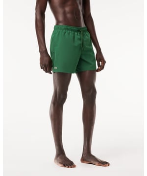 Step out of the water almost dry with these recycled quick-dry recycled polyester taffeta swim shorts. Loaded with practical features including two side pockets, mesh lining and a contrast drawstring. Your weekend getaway just got more exciting.
Light recycled quick-dry taffeta (smooth, very light weaved fabric with a slightly shiny finish)Side pocketsElasticised waistband with contrast drawstringMesh liningEmbroidered green crocodile on thighPolyester (100%)
MH6270