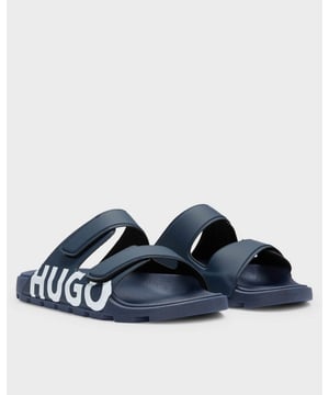 Make a statement with these Italian-made HUGO Menswear sandals. Adjustable touch-closure straps. Grip soles. Bold branding printed at the sides.

Fastening top: Slip-on
touch closure
Fully lined
Packaging: Box

 Upper material: 98% Polyvinyl chloride, 2% Polyurethane, Lining: 100% Polyester, Sole: 70% Polyvinyl chloride, 30% Thermoplastic polyurethane, Innersole: 70% Polyvinyl chloride, 30% Thermoplastic polyurethane
50542042
 