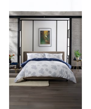 The Hyogo Bedding by The Lyndon Company is crafted from 100% cotton with a printed double gauze fabric, offering a soft, breathable, and lightweight feel. Featuring a subtle circular pattern in a calming blue and white palette, it brings a modern yet understated touch to any bedroom. The double gauze weave enhances the fabric’s natural texture, making it both comfortable and durable for year-round use.