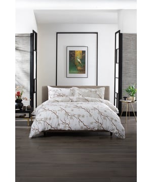 The Sakura Bedding by The Lyndon Company brings a serene, nature-inspired elegance to your bedroom with its delicate cherry blossom branch design in soft, neutral tones. Made from 100% cotton with printed double gauze fabric, it offers a luxuriously soft, breathable, and lightweight feel, perfect for year-round comfort. The airy texture and refined print create a tranquil, sophisticated aesthetic, seamlessly blending with both modern and classic interiors.