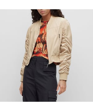 bomber jacket - cropped - round shoulder - zip closure - zip pockets - rib crew neck and rib cuffs - rushing on sleeves - contrast lining - satin - HUGO rivet detail - main material: 100% polyester - lining: 100% polyester - rib: 98% polyester  2% elastane - machine washable.