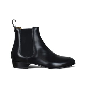 Botas Gucci de piel de becerro negra.Detalles del logo GG y lengüeta en la espalda.Inserciones elásticas negras en los laterales.Altura del tacón: 3 cm.Made in Italy.
