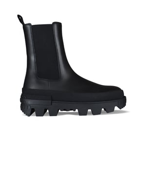 Moncler-laarzen, Coralyne-model in zwart leer.Elastische inzetstukken aan de zijkanten.Opsteektong aan de achterkant.Hielriempje met Moncler-opschrift.Gekerfde zool met rubberen logo.100% leer.Gemaakt in Italië.