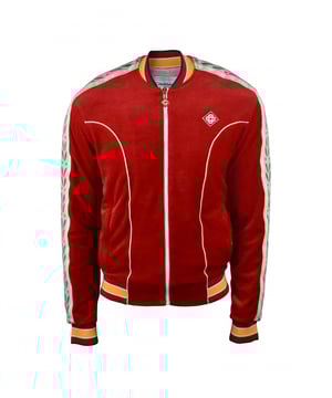 Chaqueta de chándal Laurel de terciopelo de algodón rojo Casablanca.Raya de satén de punto de laurel emblemática a lo largo de las mangas.Parche con logotipo bordado en el pecho.Extremos elásticos.Extremos con rayas amarillas y blancas.Bolsillos laterales con cremallera.Cierre principal con cremallera.