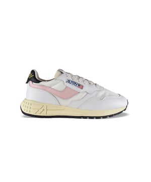Sneakers bajas Reelwind Autry de nailon y piel en blanco y negro.Parche con logotipo en el exterior. Banda de cuero rosa claro en el exterior. Contrafuerte de cuero negro con logotipo amarillo.Lengüeta con parche del logotipo.Suela de goma con efecto amarilleado y detalles negros.  Cierre con cordones blancos.