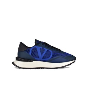 Netrunner Sneakers von Valentino Garavani.Aus elektrisch blauem, marineblauem und weißem Stoff und Leder.Signaturlogo  V  aus Leder.Gummisohle mit Gumminoppen-Detail auf der Rückseite.Made in Italy.