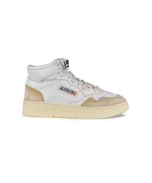 Sneakers altas Autry super vintage en piel blanca y ante.Efecto amarilleado.Parche con logotipo en el exterior. Contrafuerte de piel blanca con logotipo en relieve.Lengüeta con parche del logotipo.Suela de caucho efecto vintage.  Cierre con cordones.Puntera redonda perforada.100% piel.